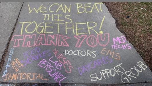 message of thanks written in chalk on sidewalk